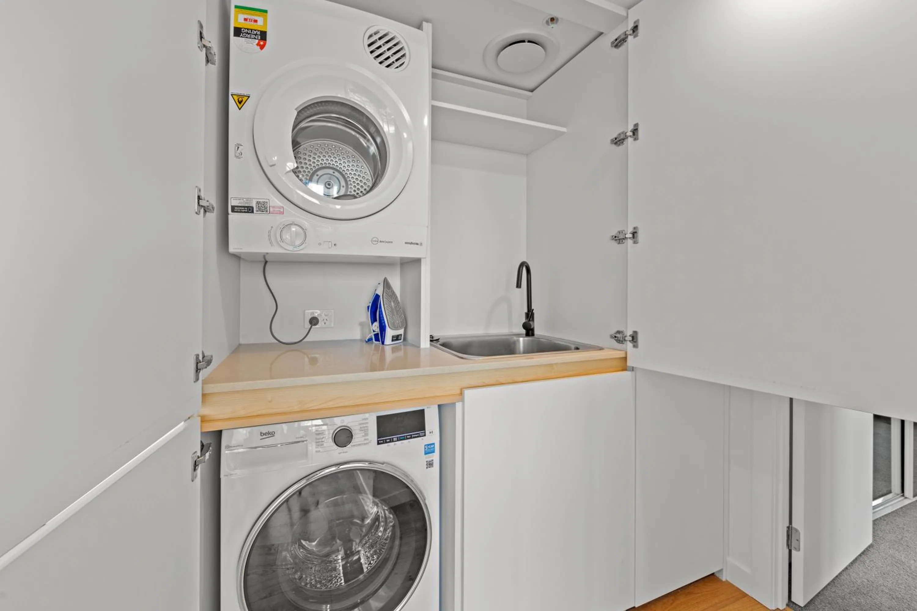 washing machine in Marine Quarter Apartments by CLLIX
