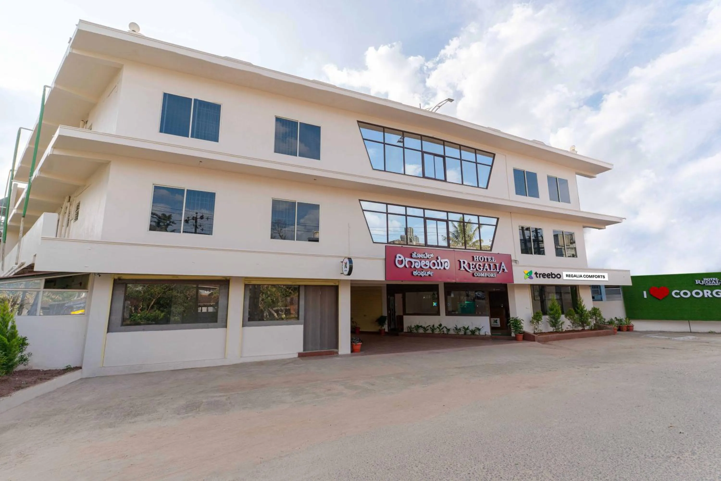 Property building in Treebo Regalia Comforts, 15 Mins From Abbey Waterfall