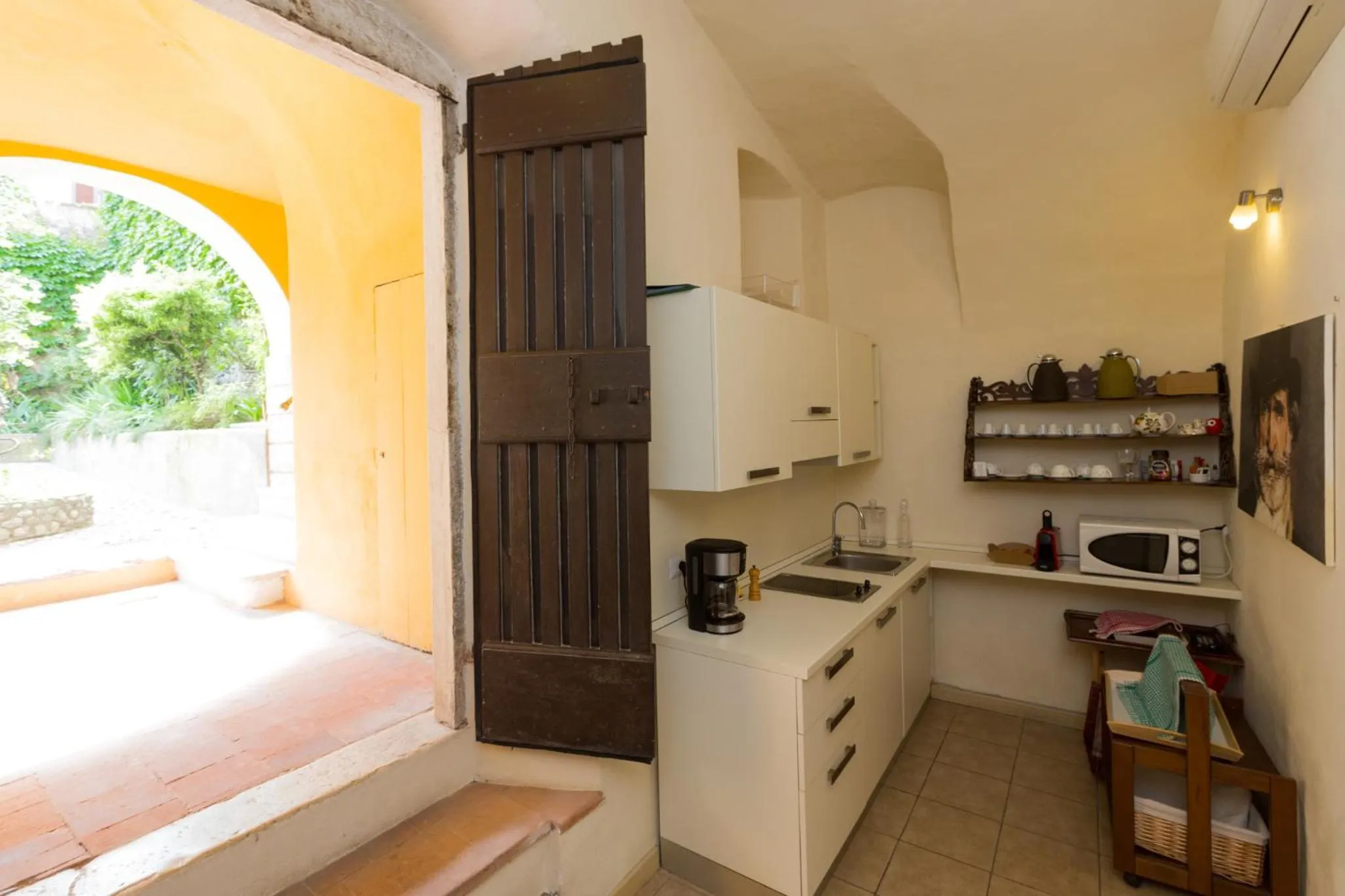 Communal kitchen in B&B Corte delle Muse