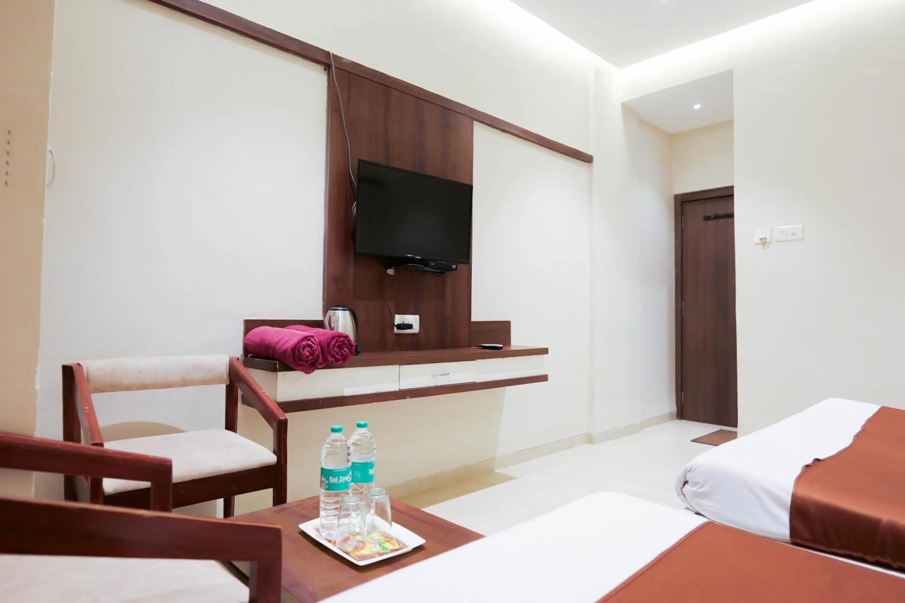 Seating area, Bed in Hotel Laxmibai Palace- Only 300 miter from Sai Baba Temple!!!!