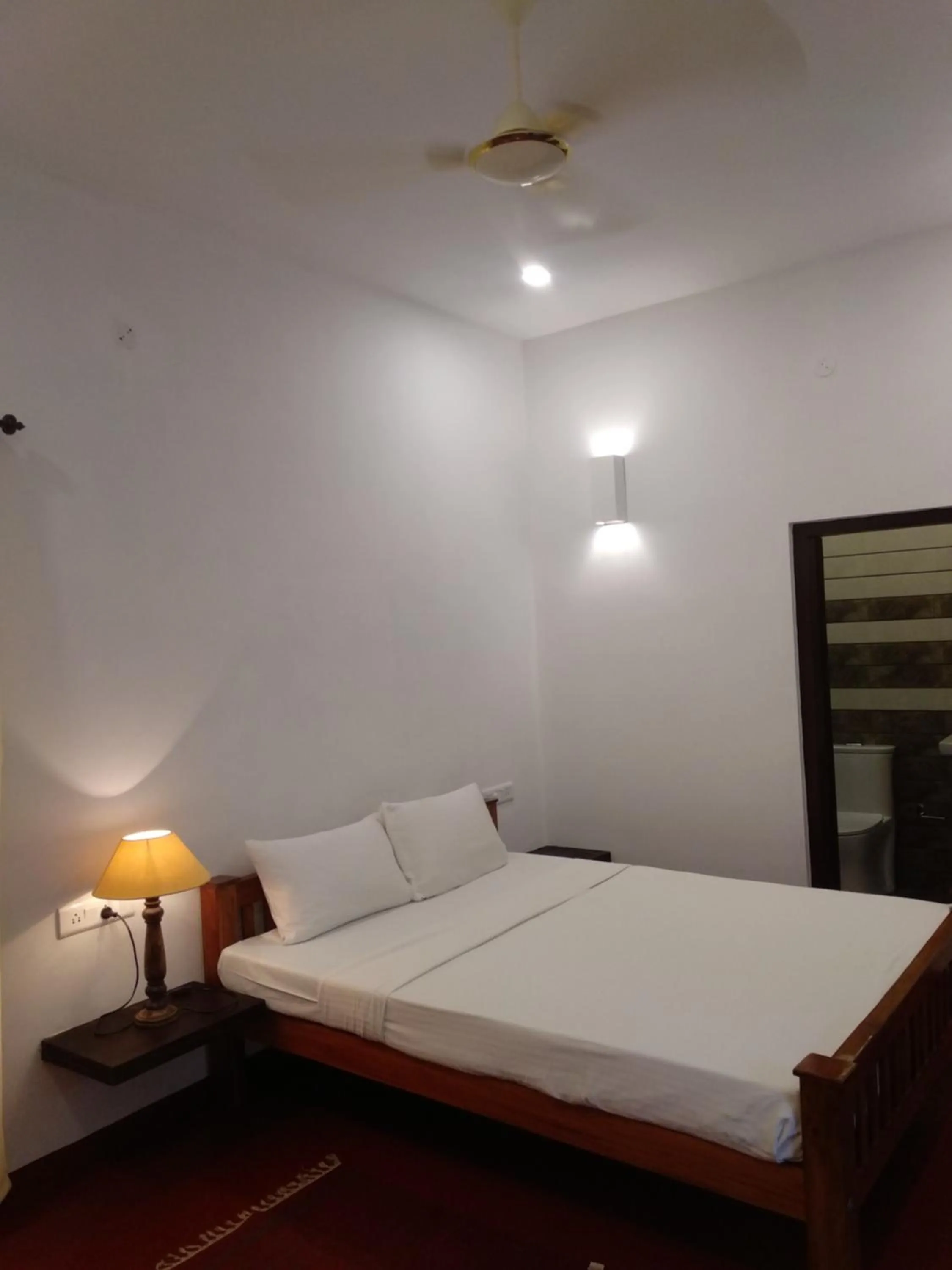 Bed in Marari Umapathi Beach Villa