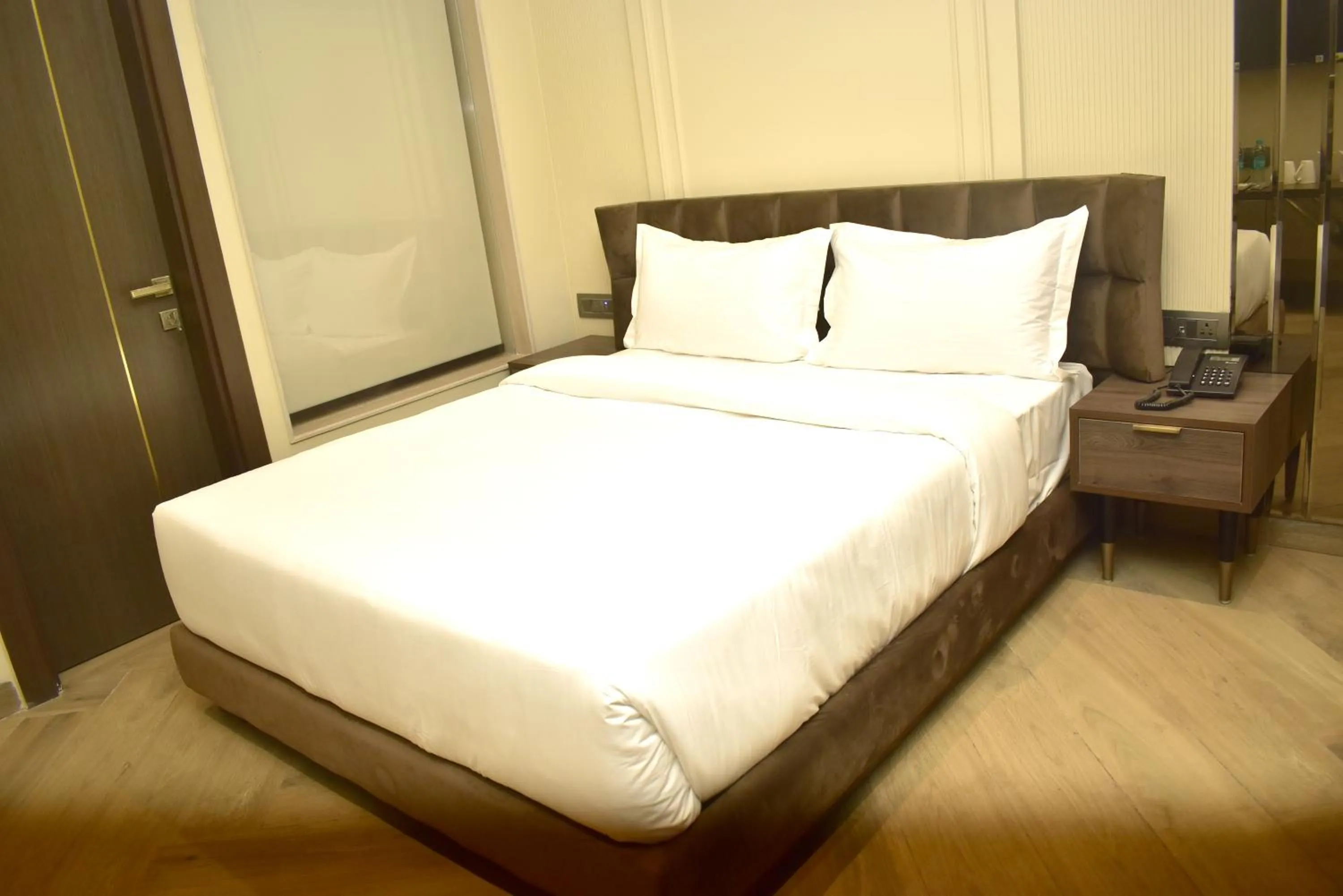 Bed in Qotel Signature Coleman Janakpuri