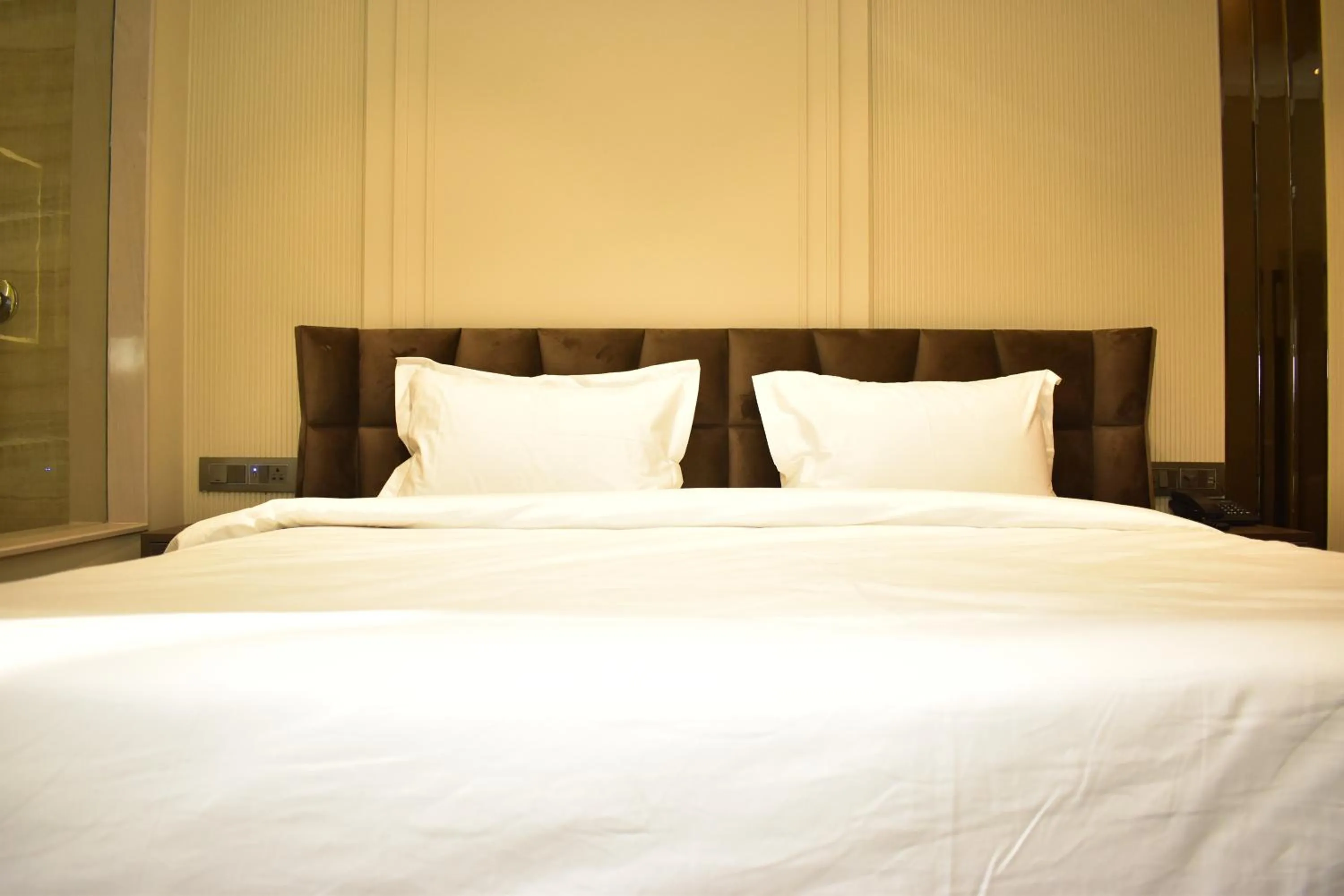 Bed in Qotel Signature Coleman Janakpuri