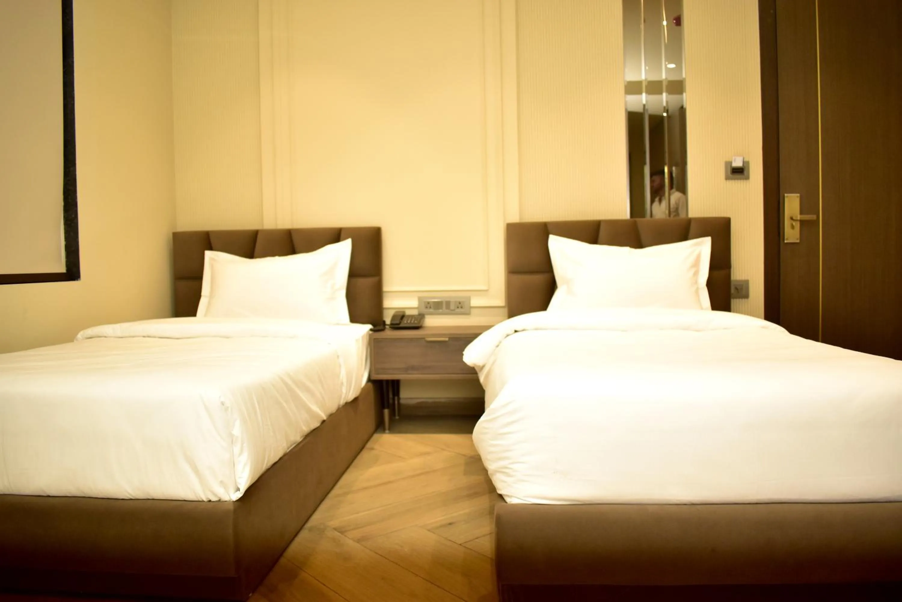 Bed in Qotel Signature Coleman Janakpuri