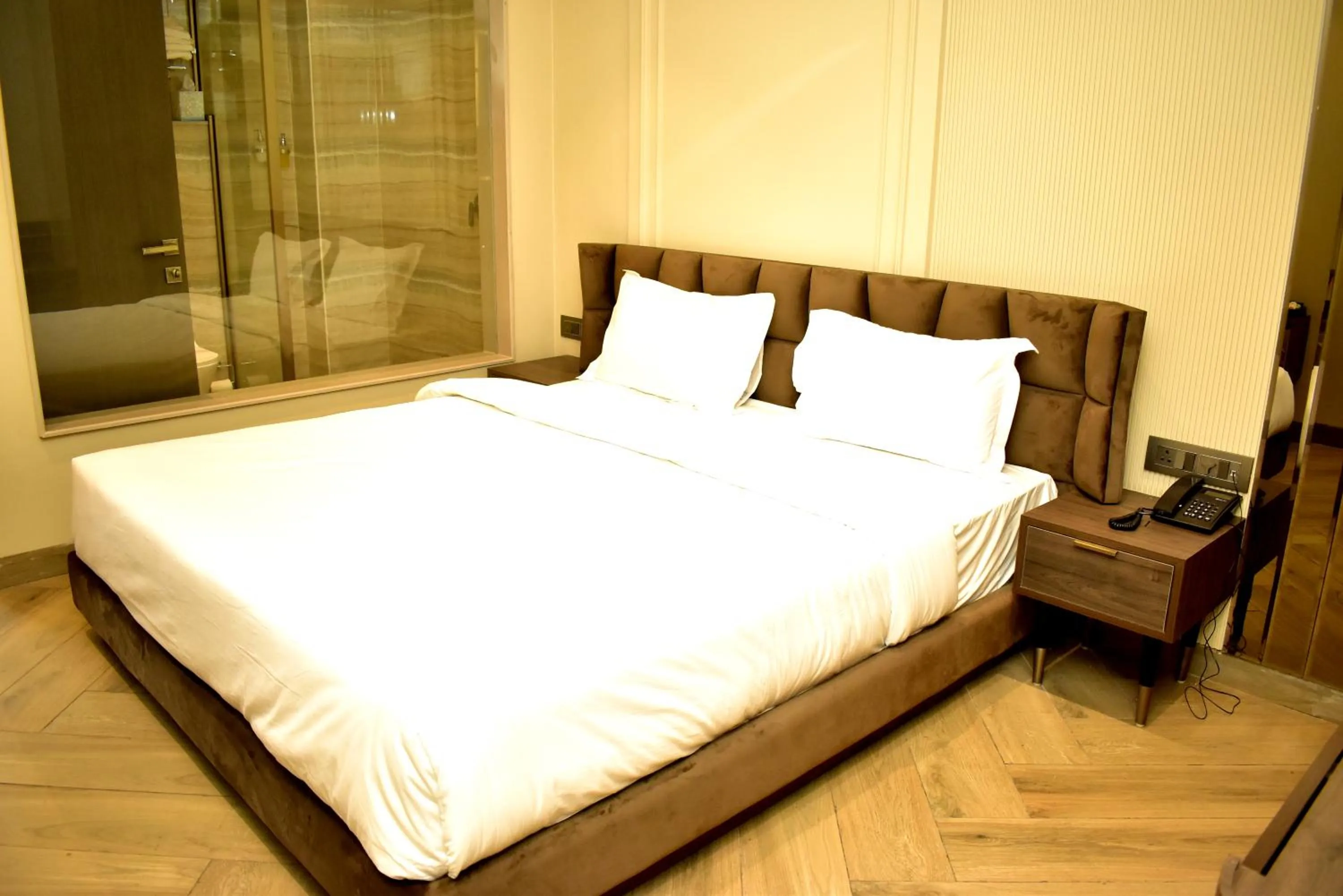 Bed in Qotel Signature Coleman Janakpuri