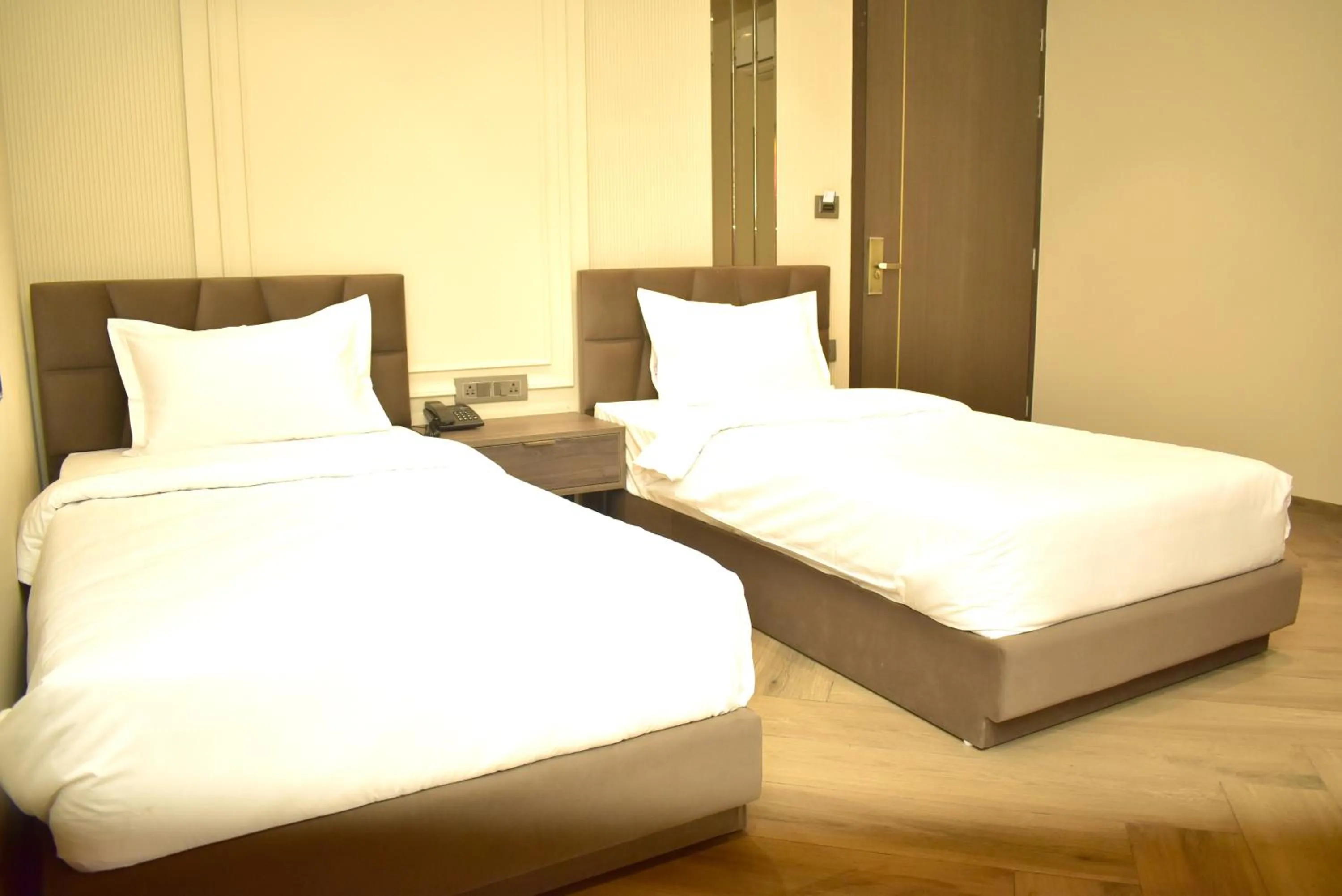Bed in Qotel Signature Coleman Janakpuri