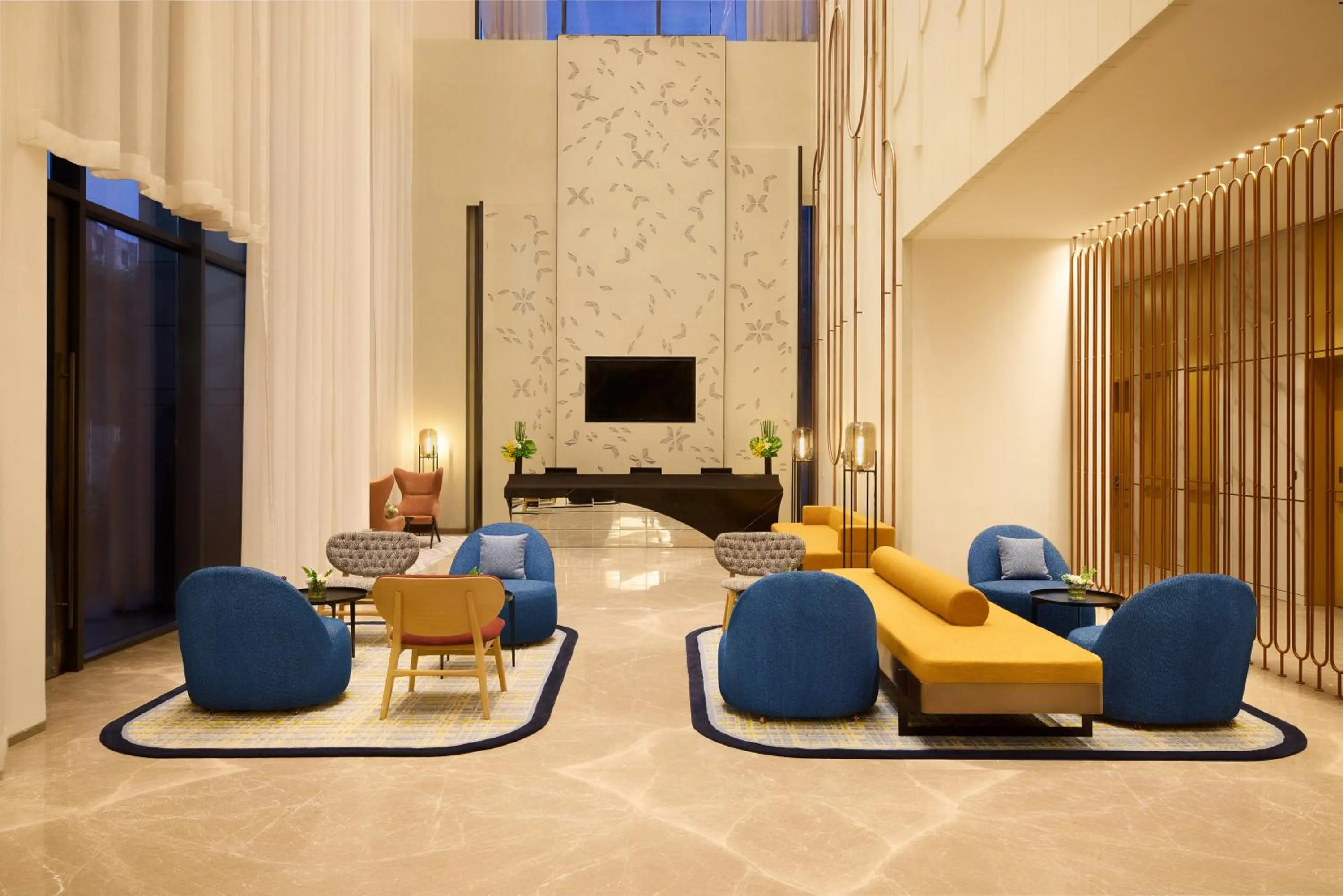 Communal lounge/ TV room in Novotel New Delhi City Centre