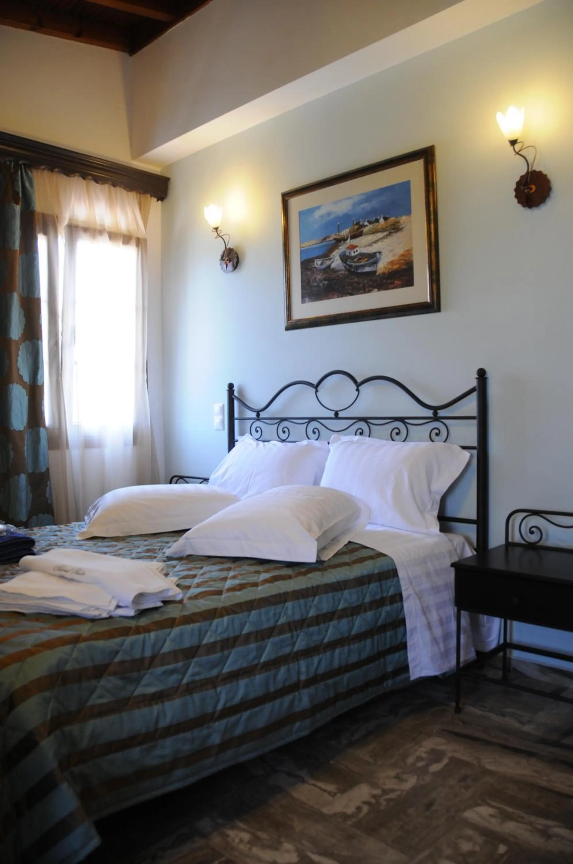 Bed in Skiathos Island Suites