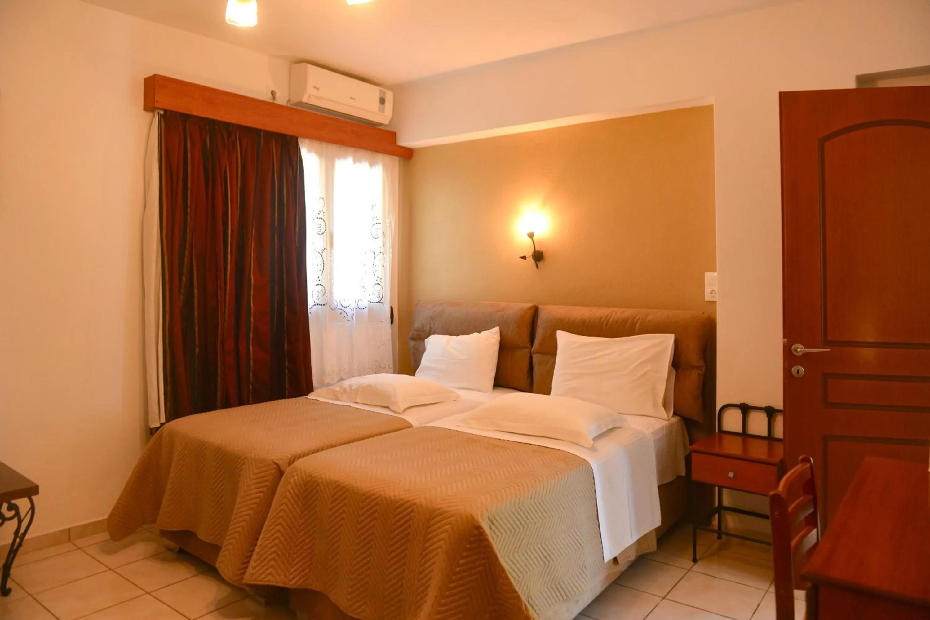 Bed in Skiathos Island Suites