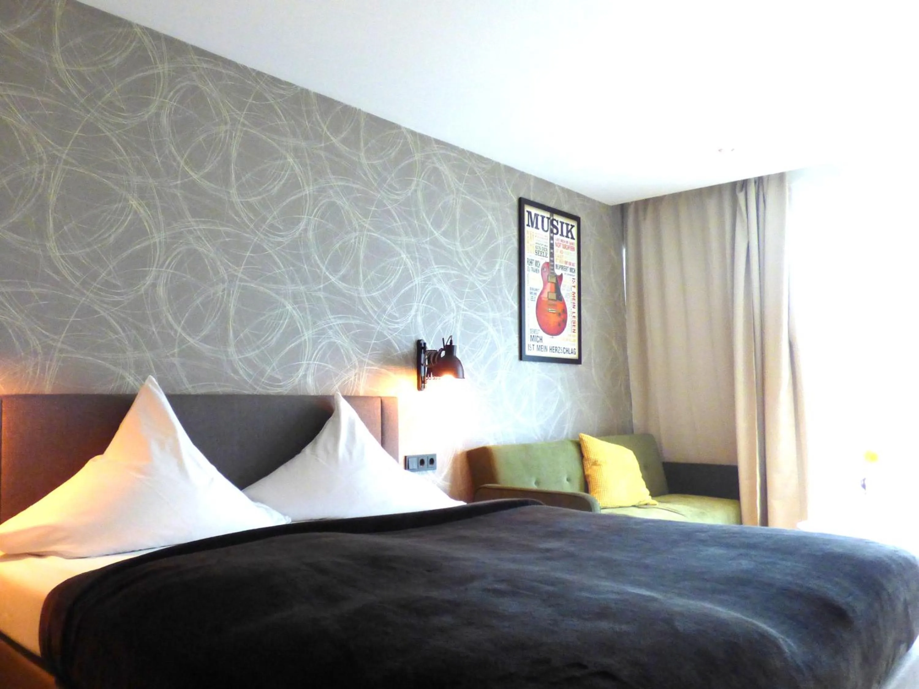 Bed in Niteroom Boutiquehotel & Apartements