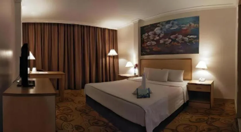 Bed in The Orchid Hotel