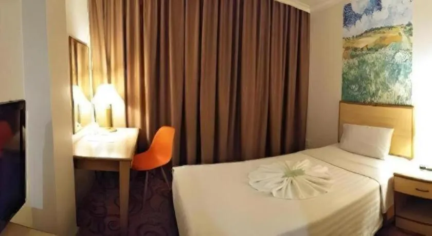 Bed in The Orchid Hotel