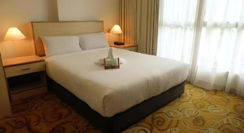 Bed in The Orchid Hotel