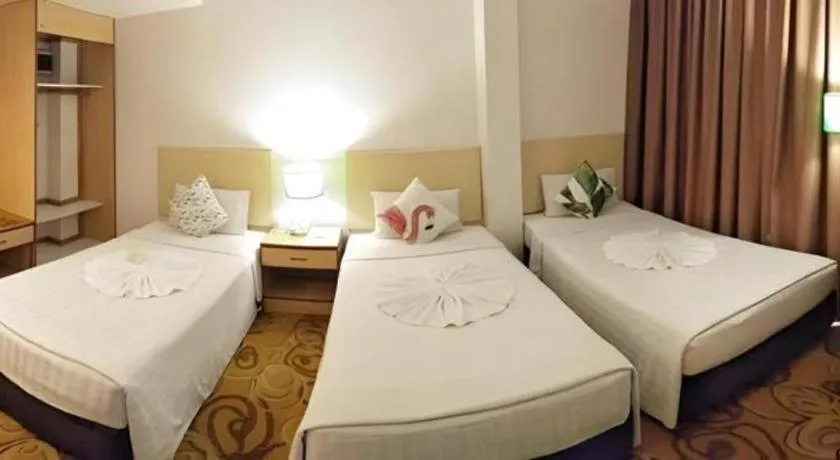 Bed in The Orchid Hotel