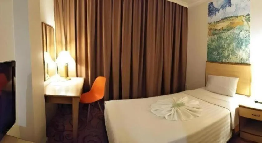 Bed in The Orchid Hotel