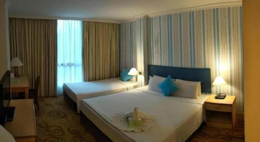 Bed in The Orchid Hotel