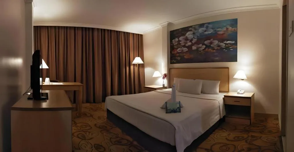 Bed in The Orchid Hotel