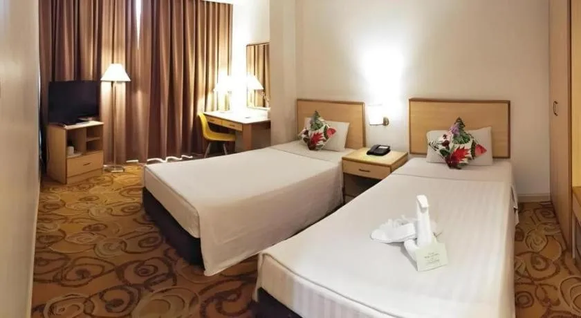 Bed in The Orchid Hotel