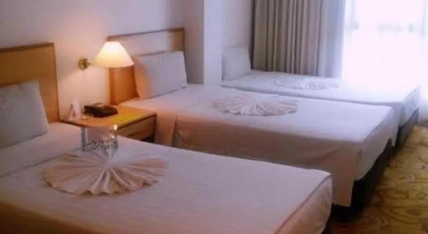 Bed in The Orchid Hotel