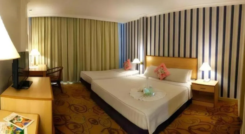 Bed in The Orchid Hotel