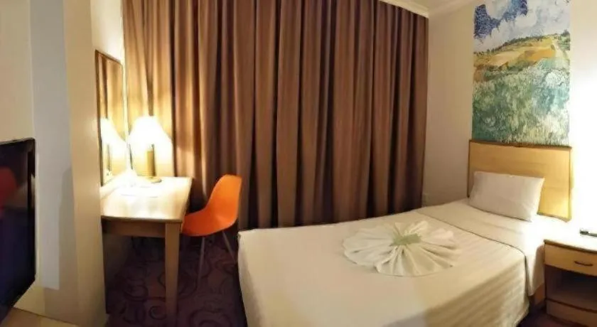 Bed in The Orchid Hotel