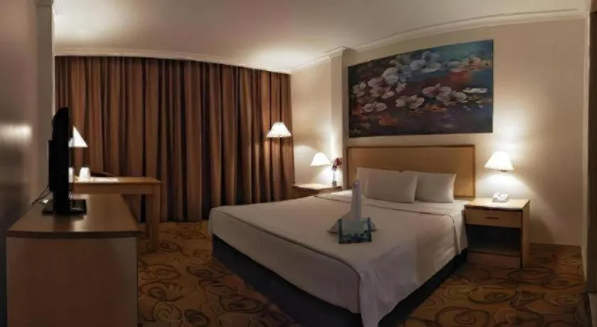 Bed in The Orchid Hotel