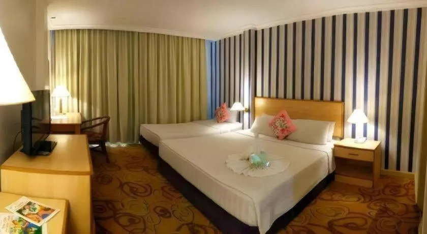 Bed in The Orchid Hotel