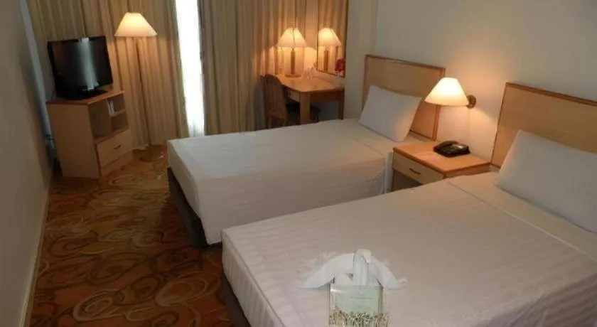 Bed in The Orchid Hotel