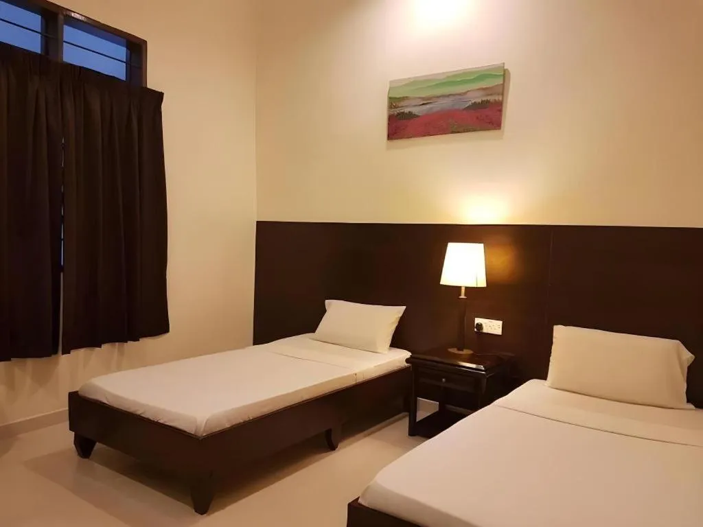 Bed in Perhentian Tivoli Inn