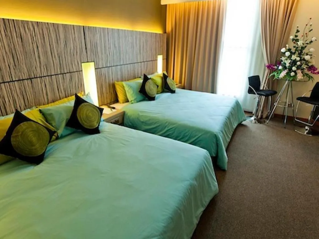 Bed in Grand Medallion Hotel