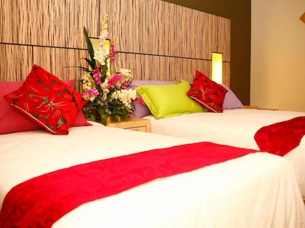 Bed in Grand Medallion Hotel