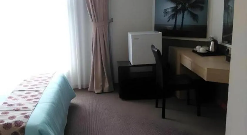 Bed in Grand Medallion Hotel