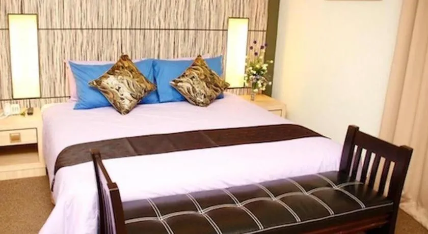 Bed in Grand Medallion Hotel