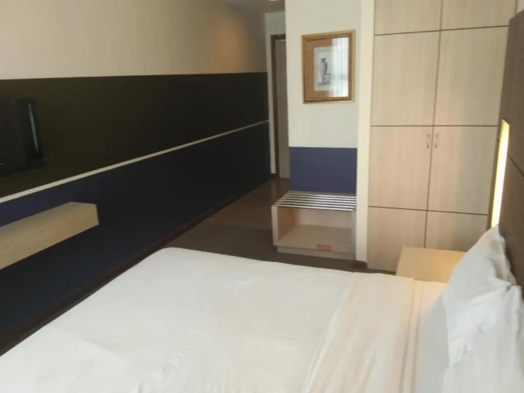 Bed in Grand Medallion Hotel