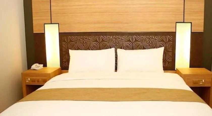 Bed in Grand Medallion Hotel