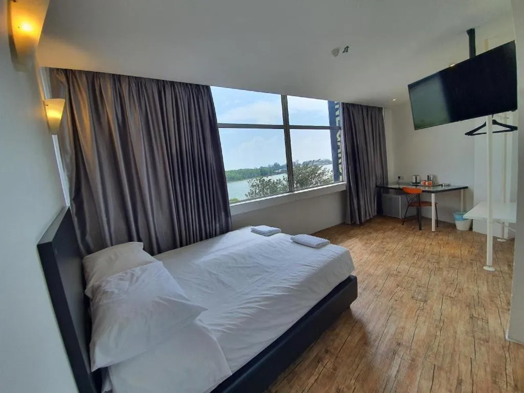 Bed in Riverine Garden Hotel