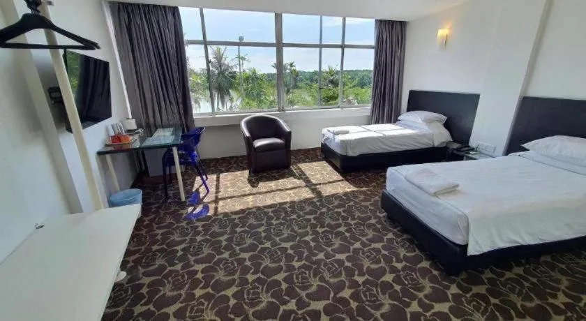 Bed in Riverine Garden Hotel