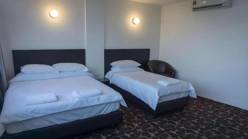 Bed in Riverine Garden Hotel