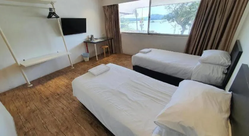 Bed in Riverine Garden Hotel