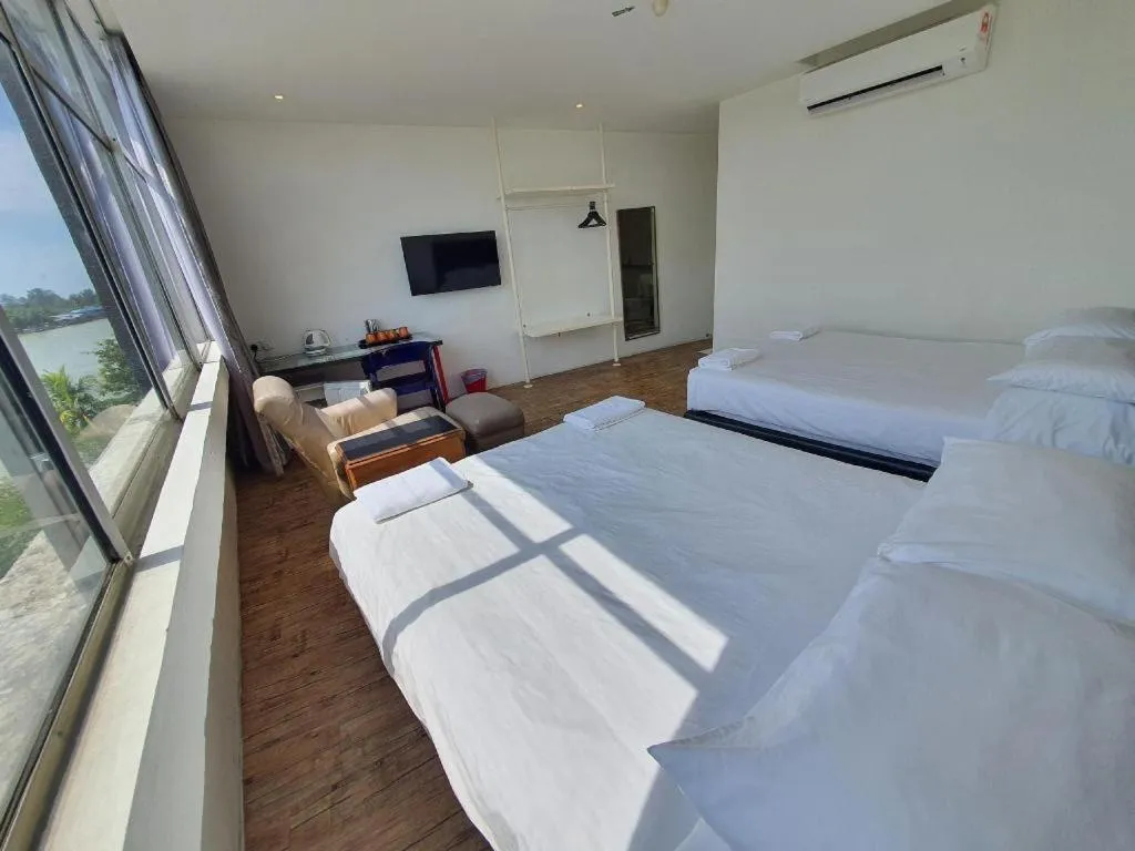 Bed in Riverine Garden Hotel