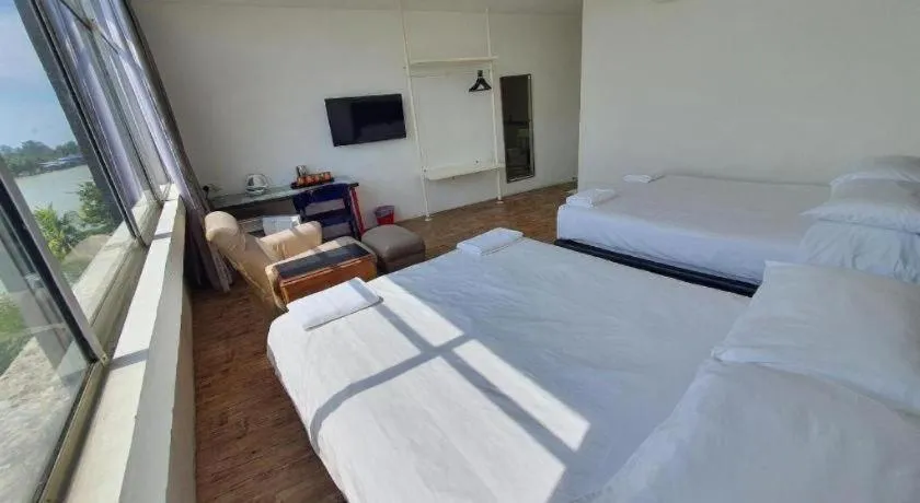 Bed in Riverine Garden Hotel