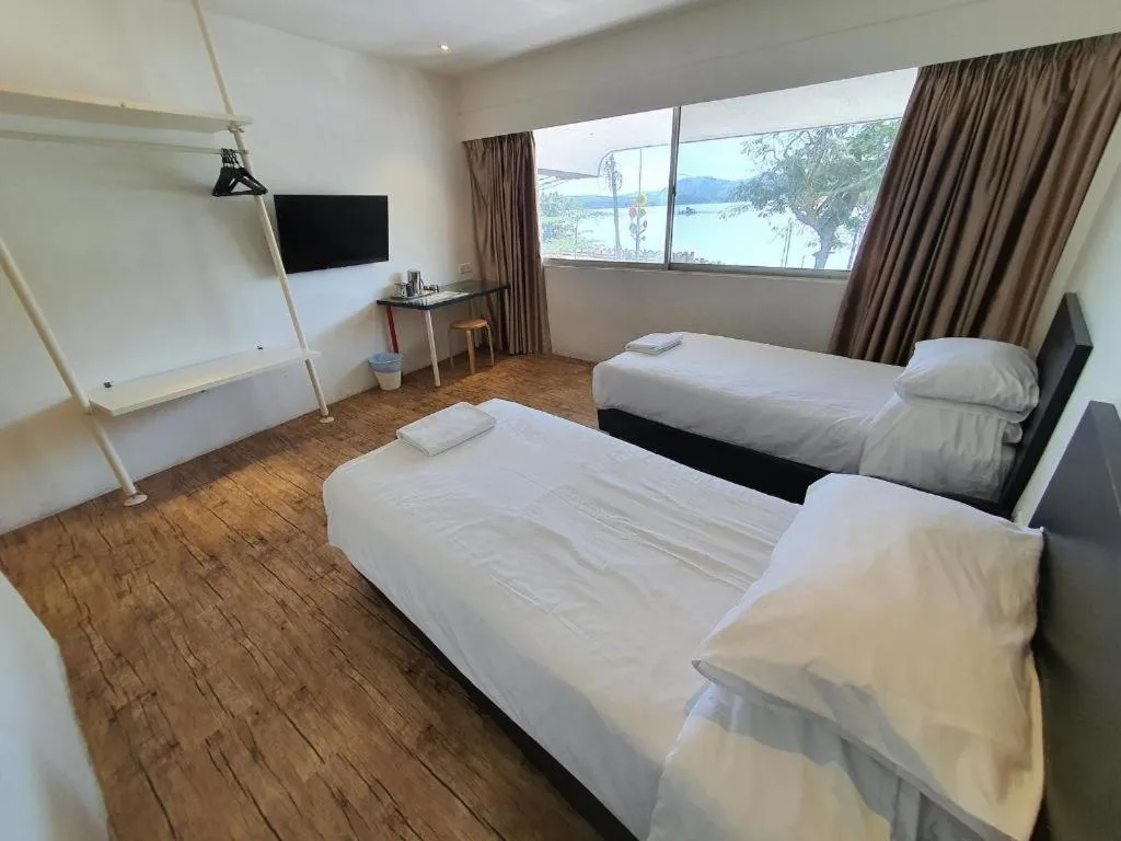 Bed in Riverine Garden Hotel