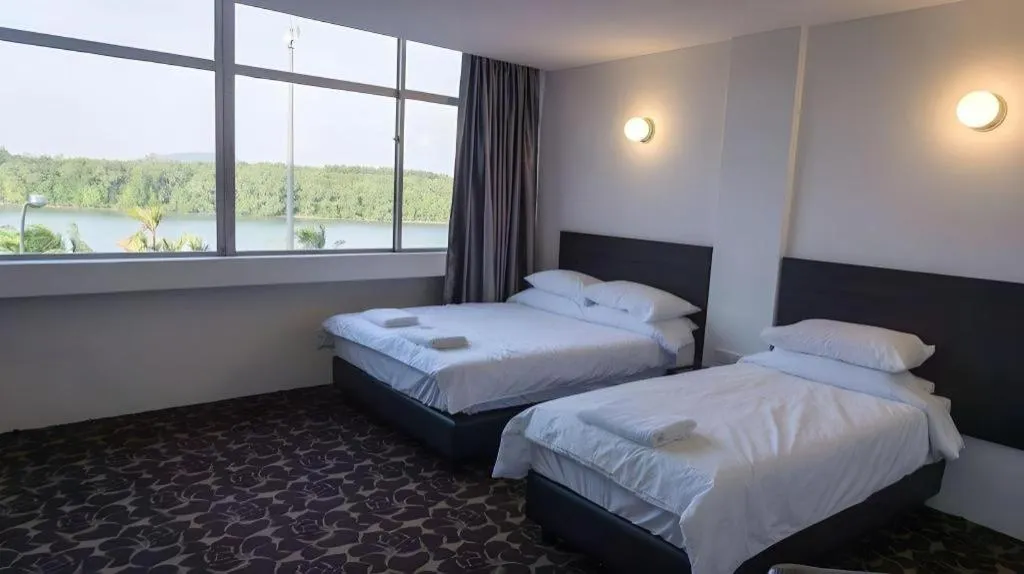 Bed in Riverine Garden Hotel