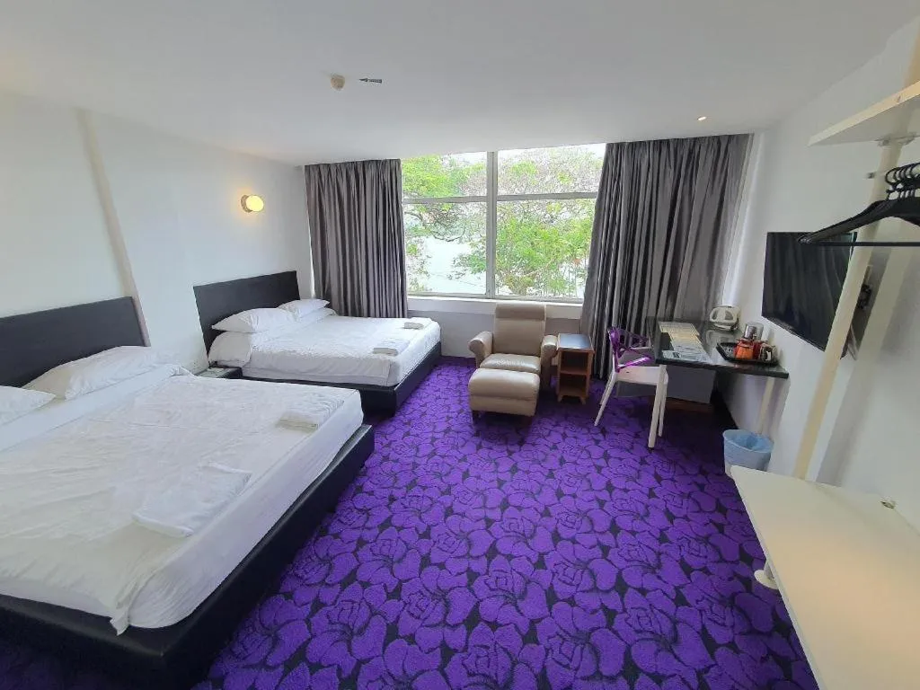 Bed in Riverine Garden Hotel