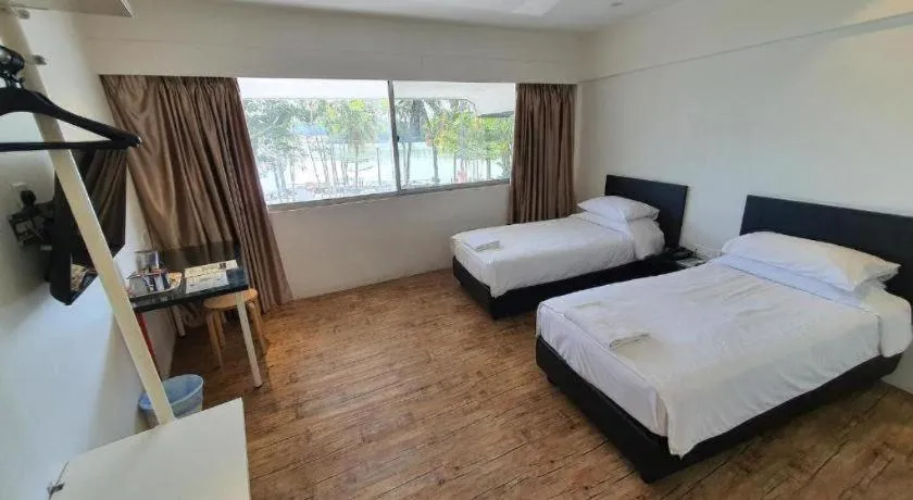 Bed in Riverine Garden Hotel