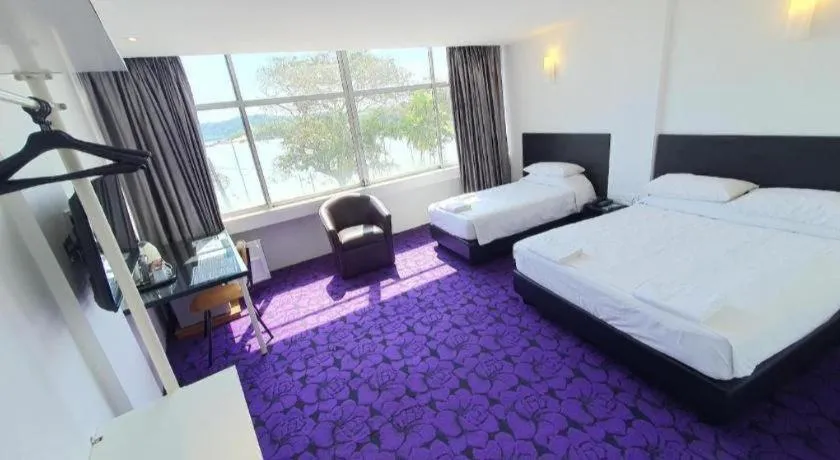 Bed in Riverine Garden Hotel