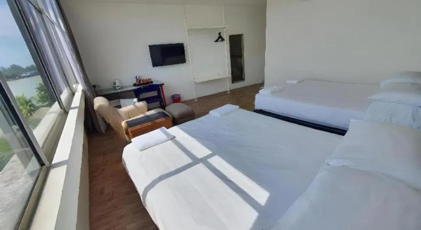 Bed in Riverine Garden Hotel