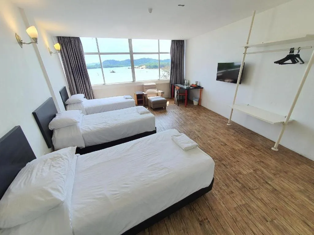 Bed in Riverine Garden Hotel