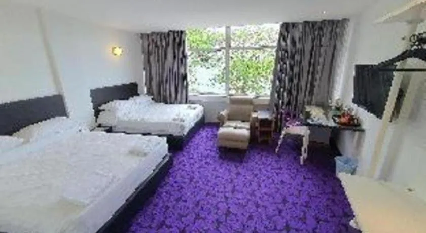 Bed in Riverine Garden Hotel