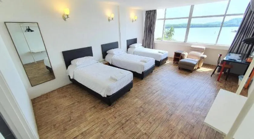 Bed in Riverine Garden Hotel